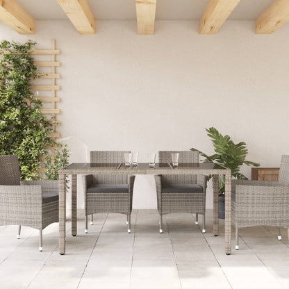 Tuintafel met glazen blad 150x90x75 cm poly rattan grijs - AllerleiShop