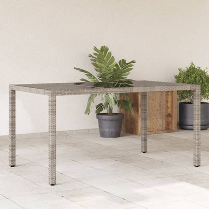 Tuintafel met glazen blad 150x90x75 cm poly rattan grijs - AllerleiShop