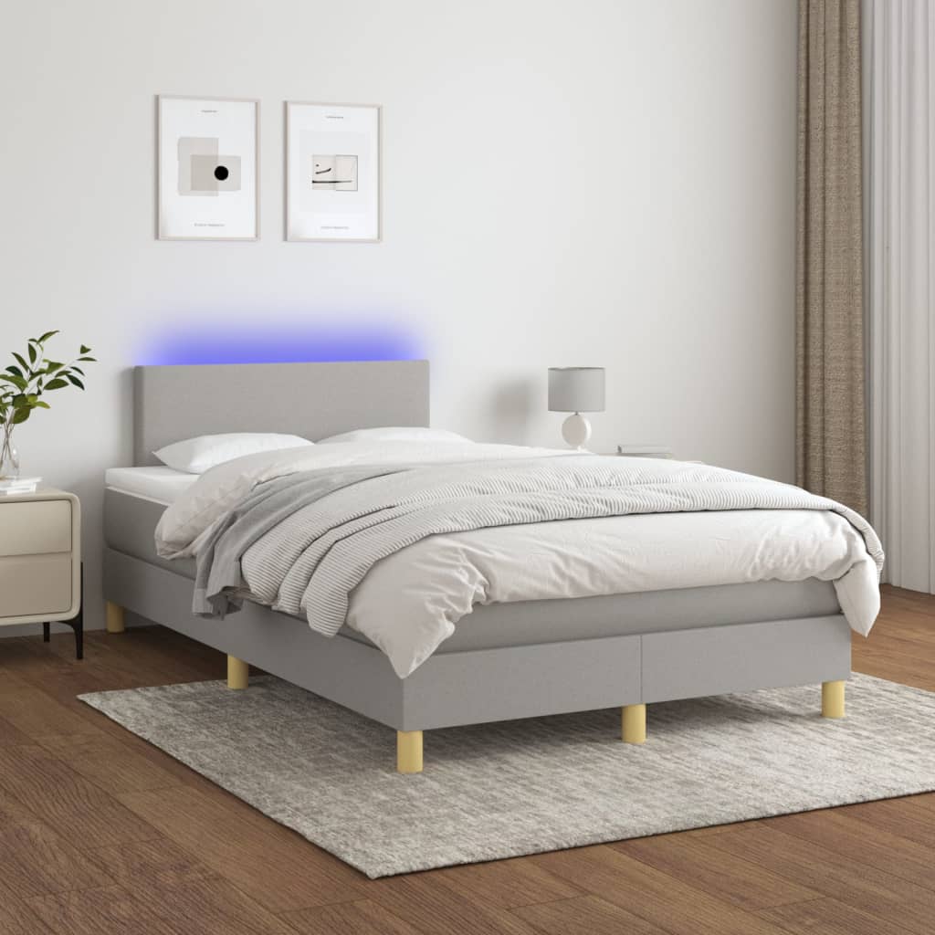 Boxspring met matras en LED stof lichtgrijs 120x190 cm