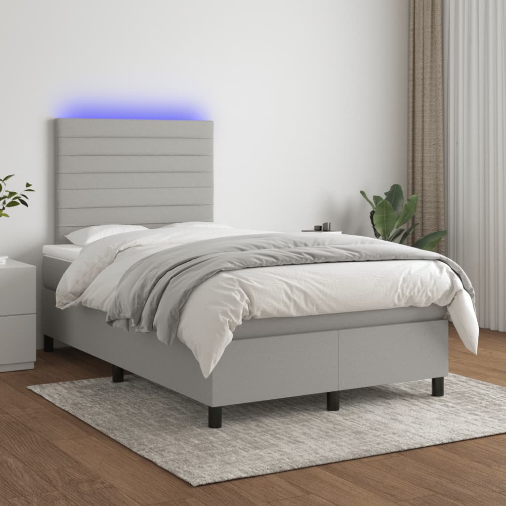 Boxspring met matras en LED stof lichtgrijs 120x190 cm