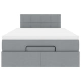 Ottoman bed met matras en LED's 120x190 cm stof lichtgrijs