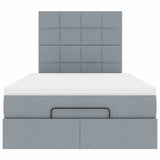 Ottoman bed met matras en LED's 120x190 cm stof lichtgrijs